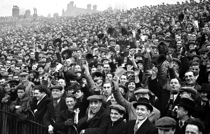 Highbury in 1938. Stewards shouting "Siddown!" not pictured